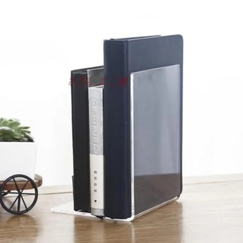 Transparent acrylic bookshelf displaying two books on a desk