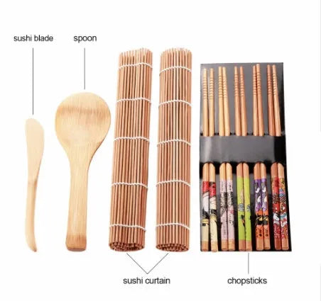 White sushi tool set with bamboo rolling mat, rice paddle, and sushi mold on a surface.