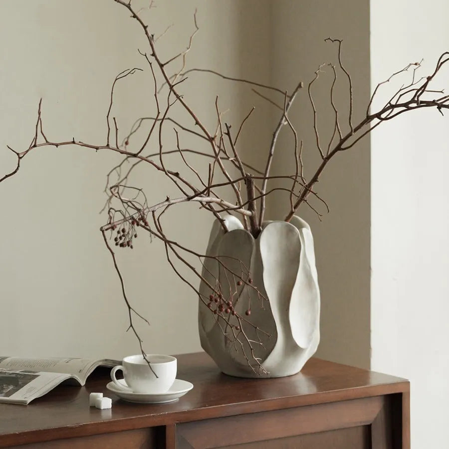 Irregular ceramic vase with artistic form for flower arrangements in magnesium clay construction