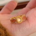 Geometric open band women's ring with pink crystal enamel on copper gold plating, colour K227.
