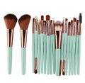 MAANGE 18-piece makeup brush and tool set with fan brushes laid out.