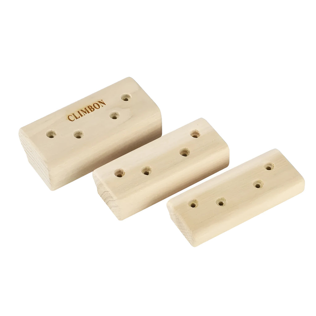 Set of three solid wooden grip strength training hangboards in different sizes on a grey background.