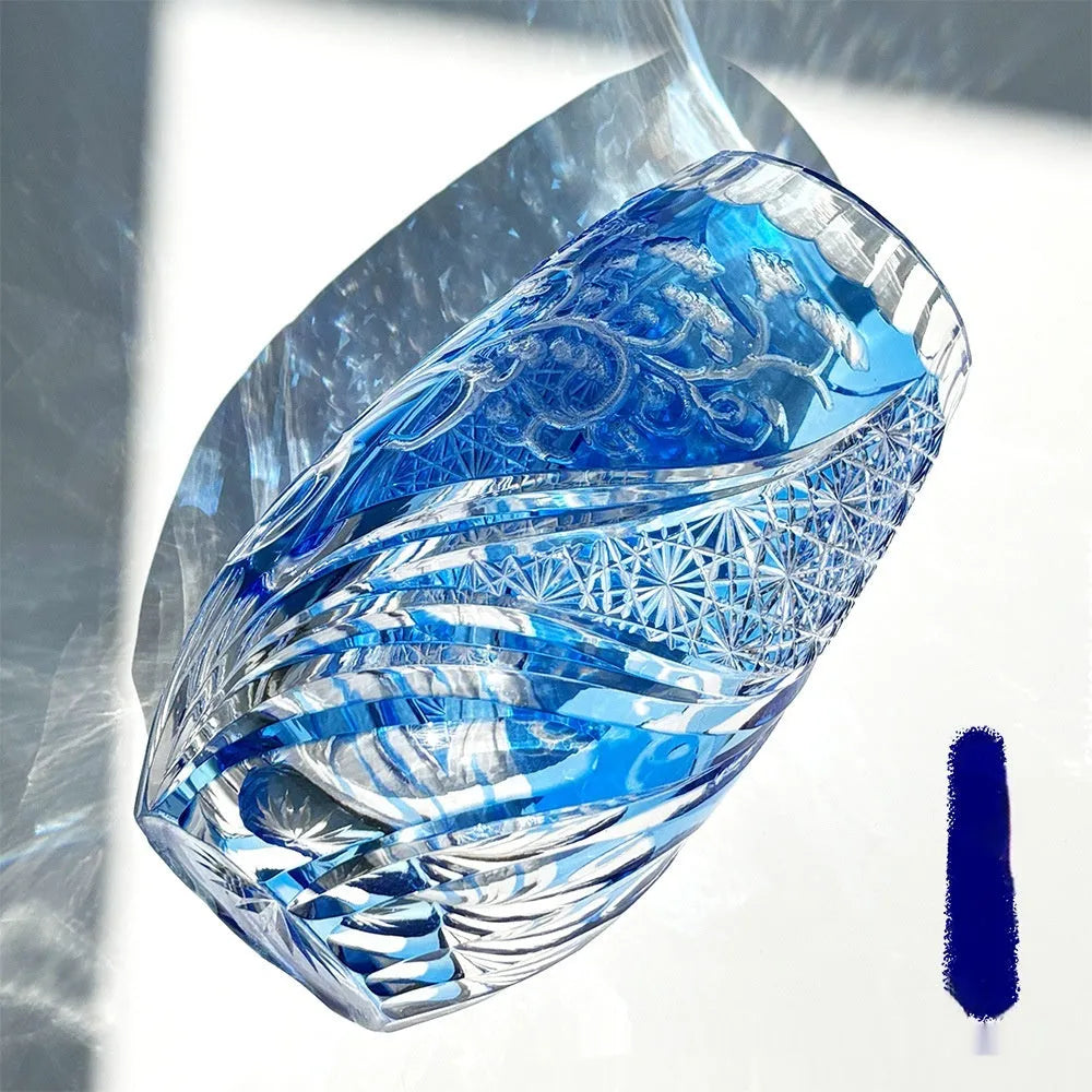Blue Jianghu cut crystal glass tumbler 80x190mm on a wooden surface