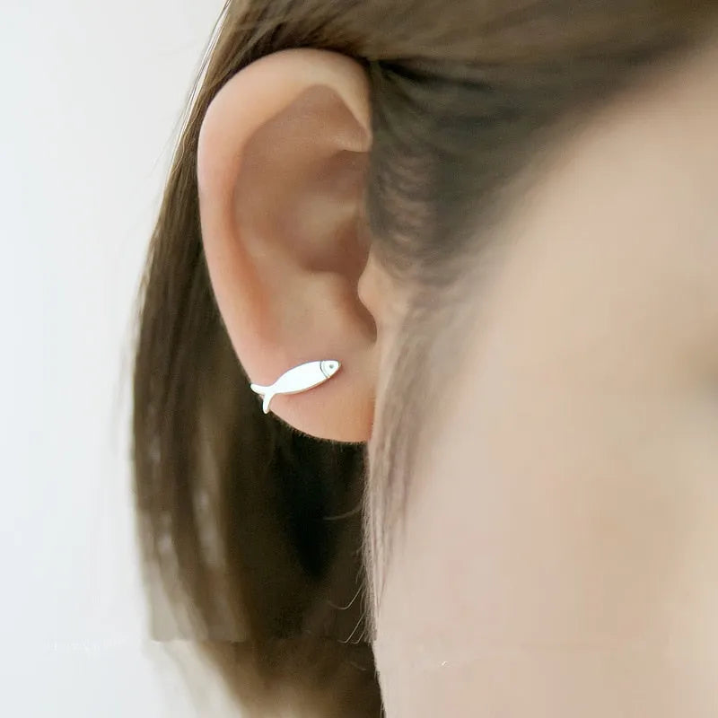 S925 sterling silver stud earrings with asymmetrical cat and fish design on white background