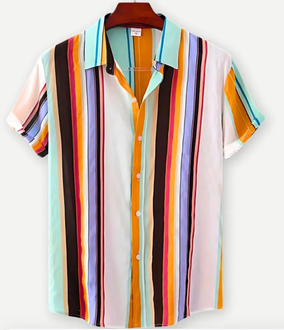 Man's short sleeve Hawaiian print shirt with lapel collar and floral pattern, shown in a casual setting.