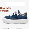 Men's low-top black canvas platform shoes with white raised sole and front lace-up.