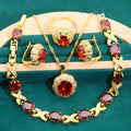 18k gold plated jewellery set showing ring, earrings, bracelet, and necklace with coloured cubic zirconia stones.