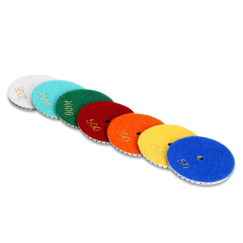 10 emery stone polishing pads in assorted grits with 80mm diameter and 10mm centre holes