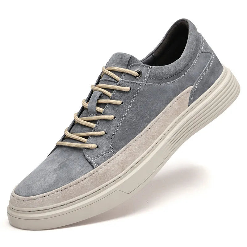 Men's grey pigskin leather casual skate shoes with round toe and flat rubber sole on a light background.
