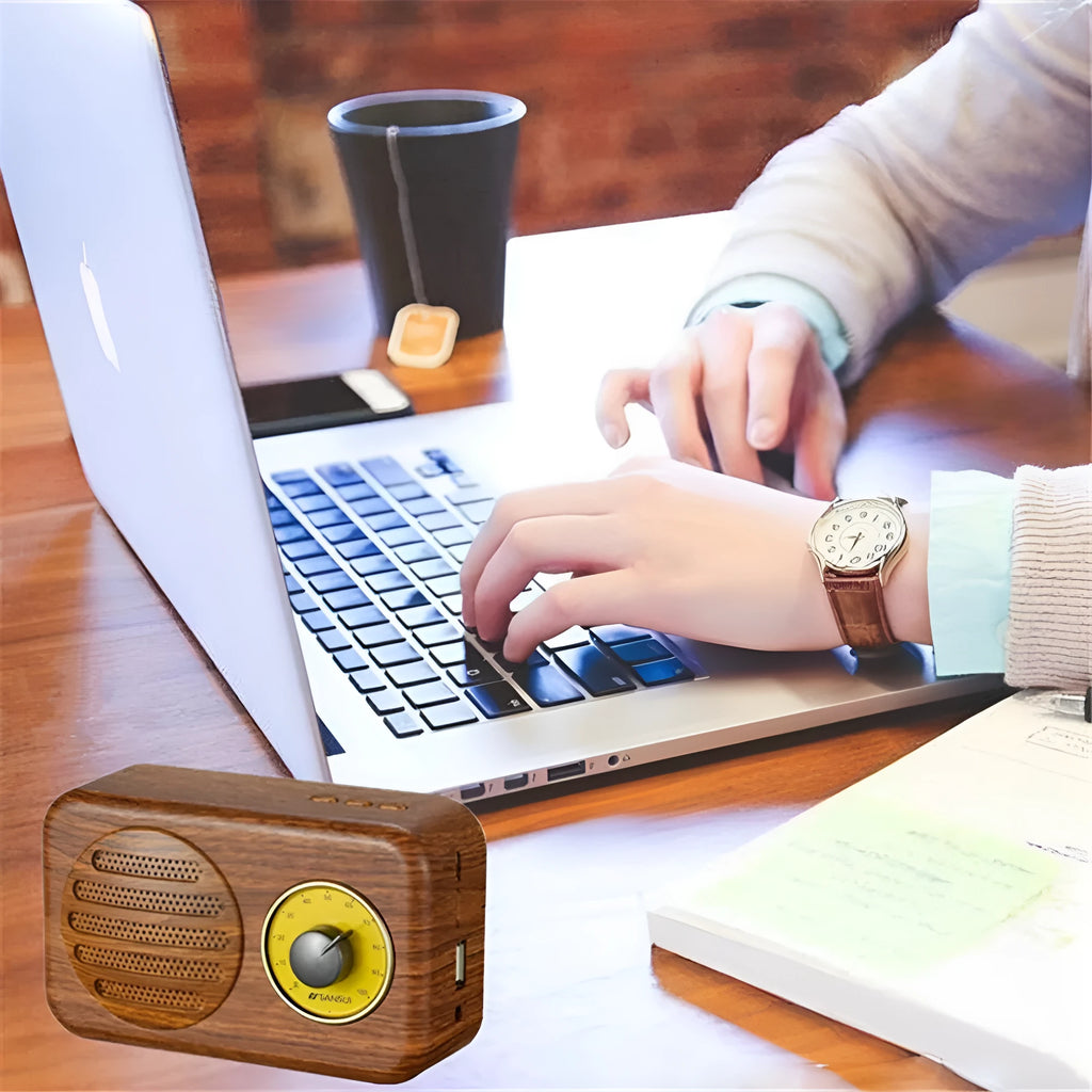 Compact portable Bluetooth speaker in wood colour finish with FM radio and USB cable.
