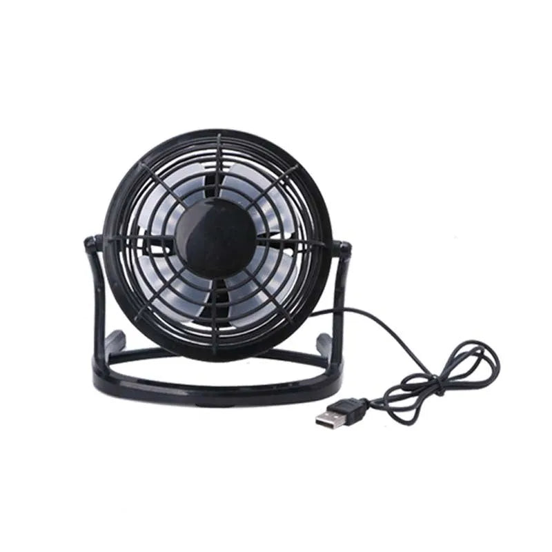 Small black adjustable USB desk fan with key switch on a wooden table.