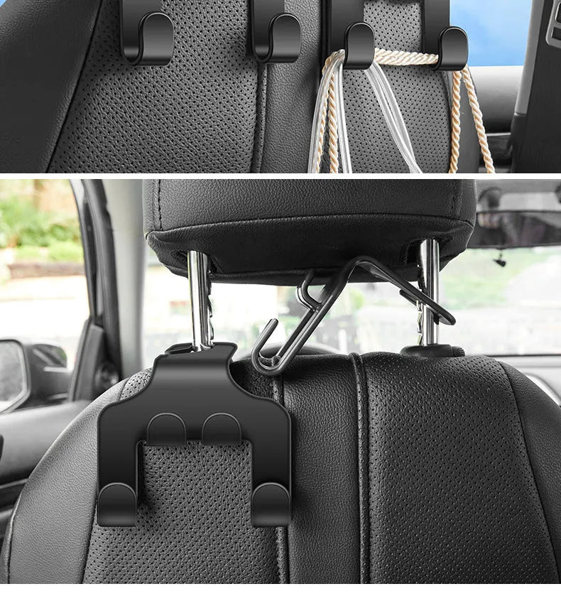 Two white ABS plastic car hooks for mounting phones and organising items in vehicles.