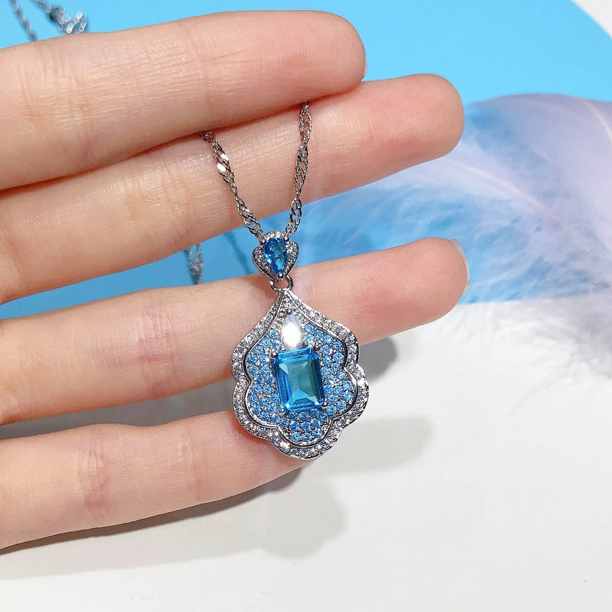 Sea blue copper geometry sky mirror pendant on plain background