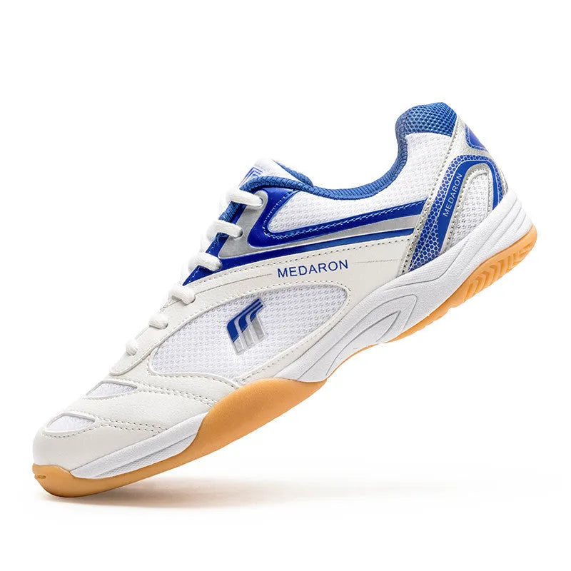 White and red table tennis sneakers with lace-up front and rubber sole.