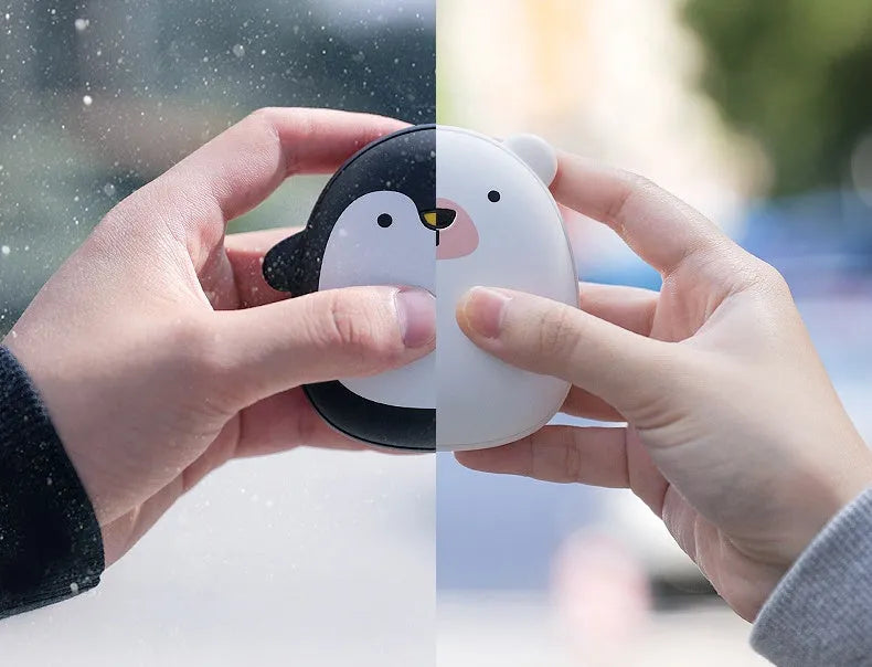 Cute cartoon penguin and polar bear design USB rechargeable hand warmer and power bank unit.