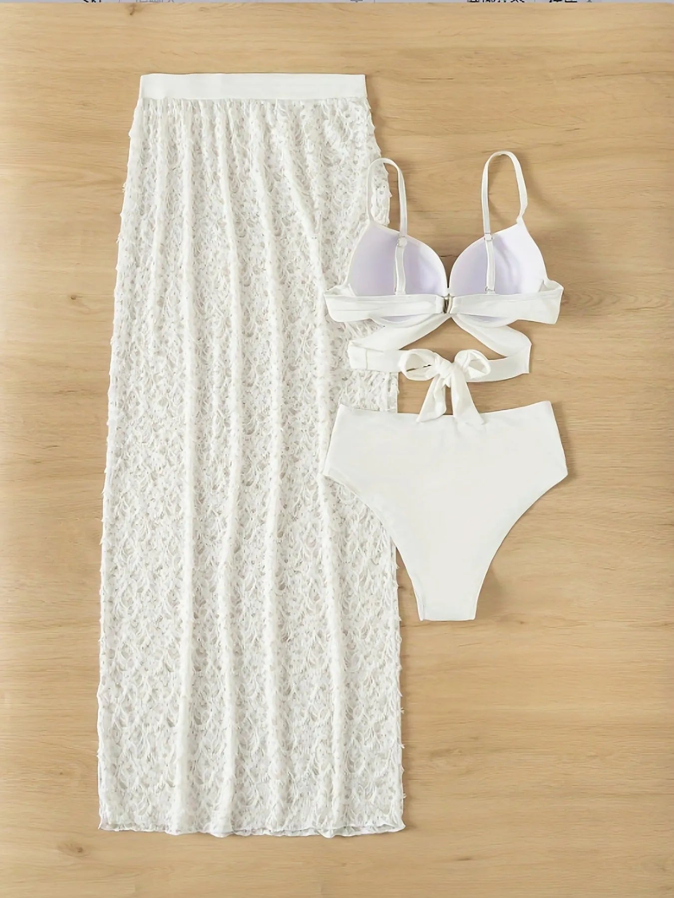 White three-piece swimsuit set with gathered long skirt, sleeveless top, and matching bottoms