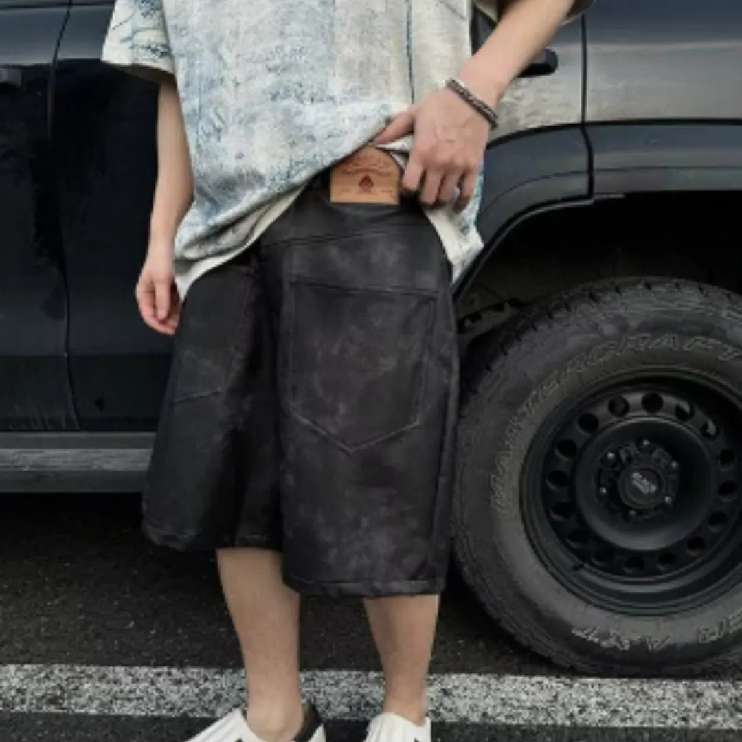A man wearing a solid-colour, loose-fit, short-sleeve t-shirt in a Korean style.