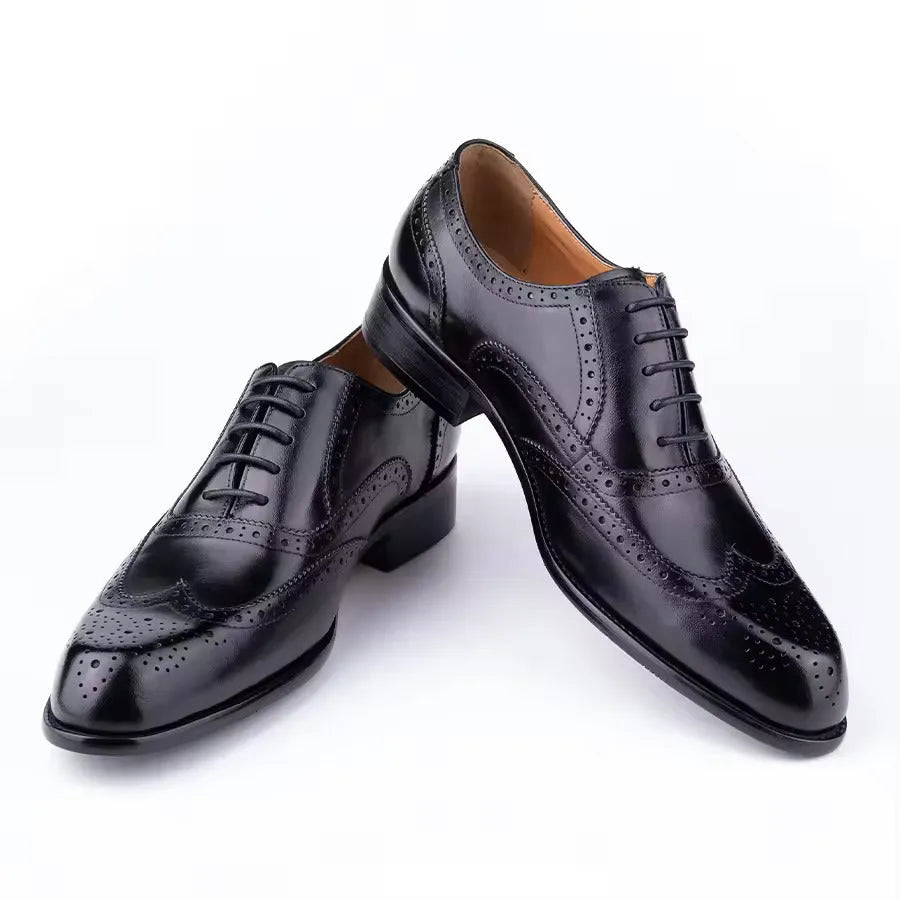 Purple men's Oxford shoes with hand-carved detailing and a pointed toe.