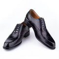 Purple men's Oxford shoes with hand-carved detailing and a pointed toe.
