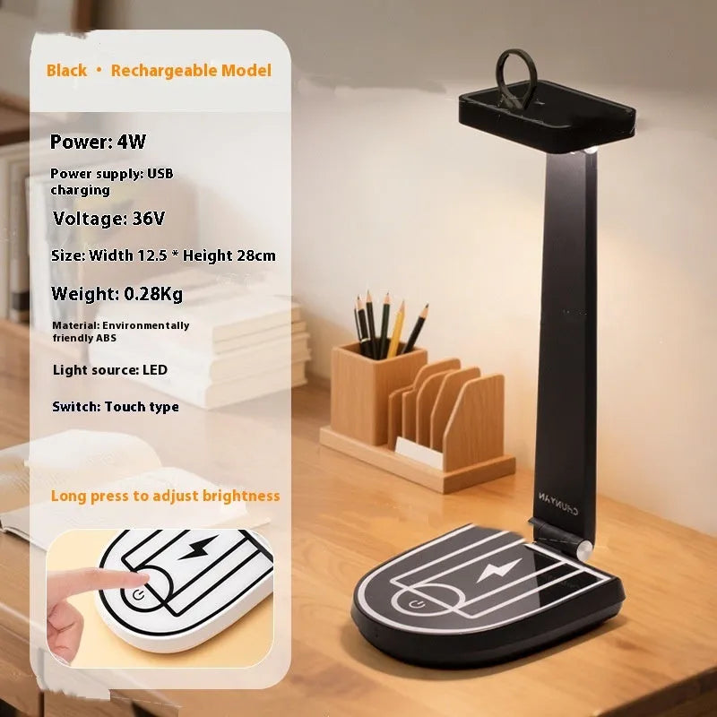 Creative basketball stand table lamp with 15W wireless charging touch, black finish, on a desk with a phone charging