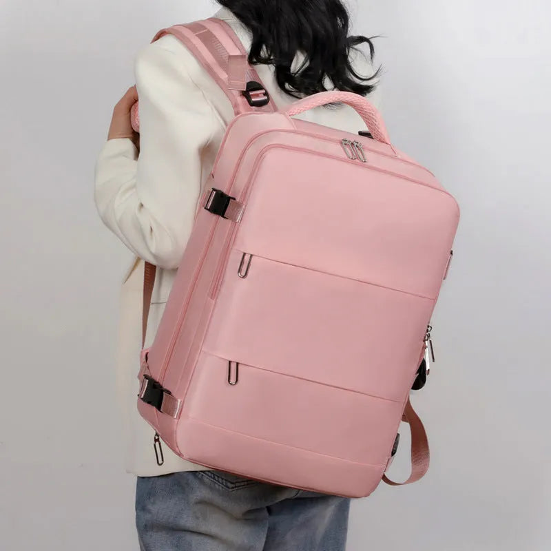 Large purple travel backpack with laptop compartment and air pillow shoulder straps shown open to reveal internal organisation pockets.
