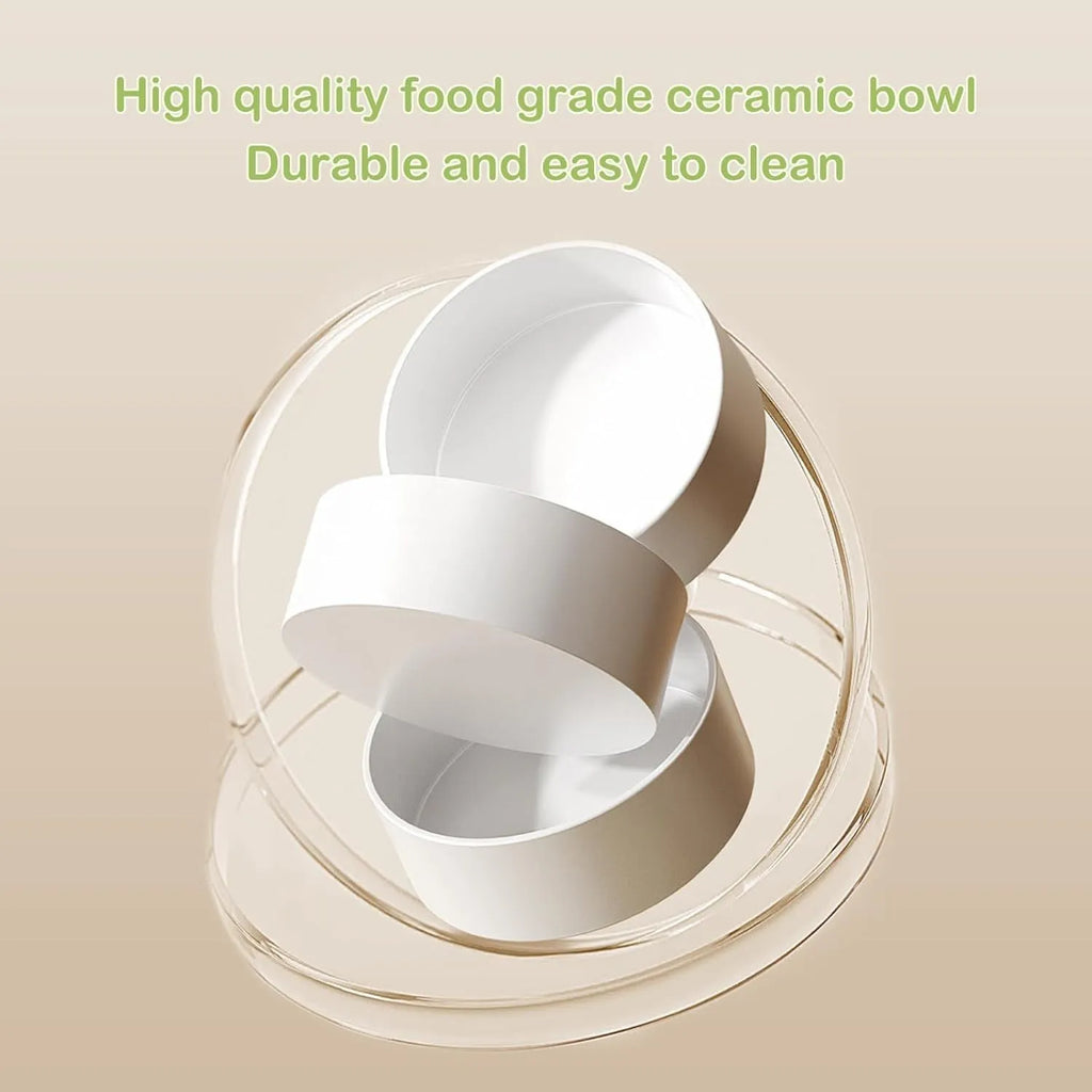 Green ceramic elevated cat bowl set with two tilted dishes on a non-slip stand.
