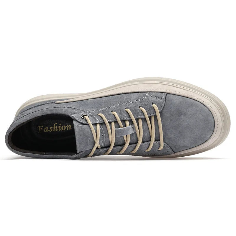 Men's grey pigskin leather casual skate shoes with round toe and flat rubber sole on a light background.