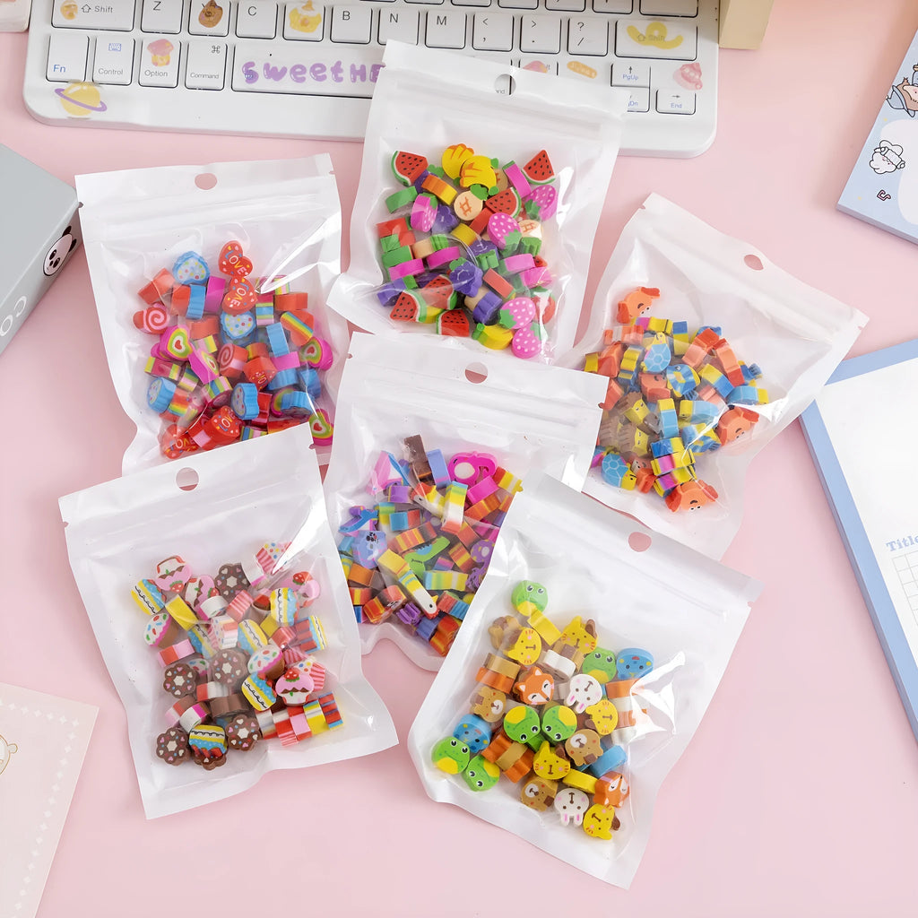 50 small colourful cartoon-themed TPR rubber erasers in a pearlescent film bag, themes include fruit, animal, and cake designs.