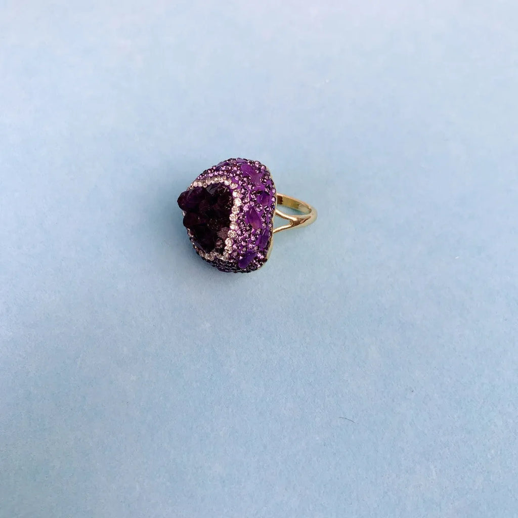 Natural Uruguay amethyst open adjustable ring on a white background showing the gemstone and open band design