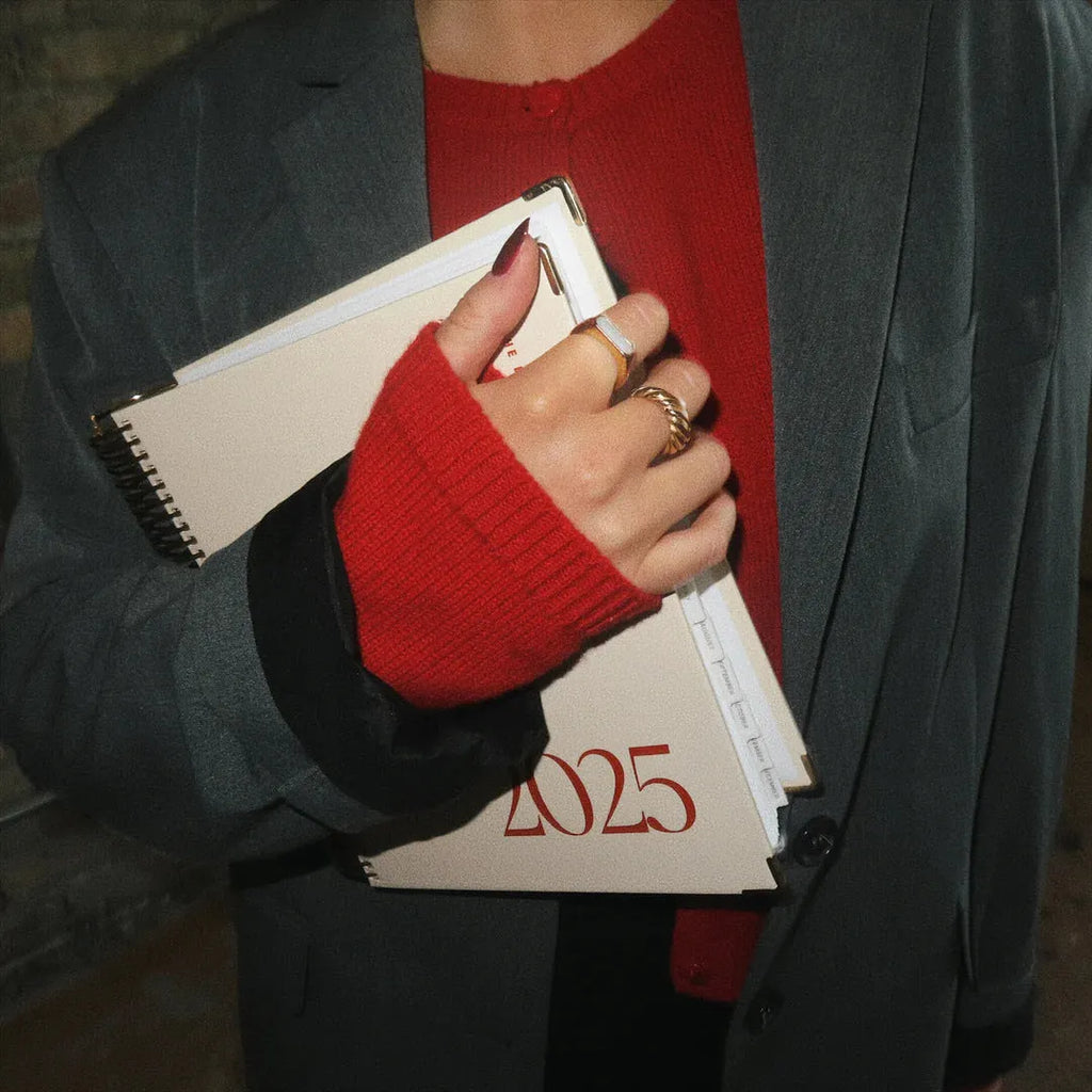 Coil notebook with cherry red cover, wire binding, and 80 sheets of ruled paper