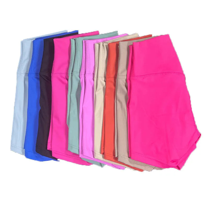 Women's high-waisted nylon yoga shorts in a selection of colours on a neutral background.