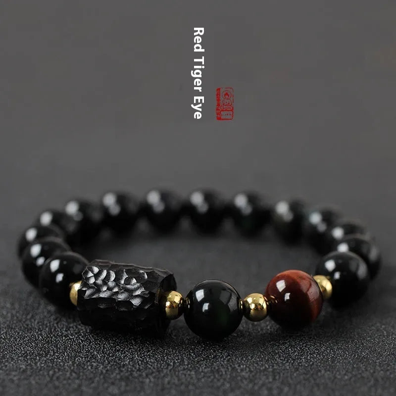 Handcrafted obsidian bracelet with 10mm yellow tiger eye beads on elastic cord
