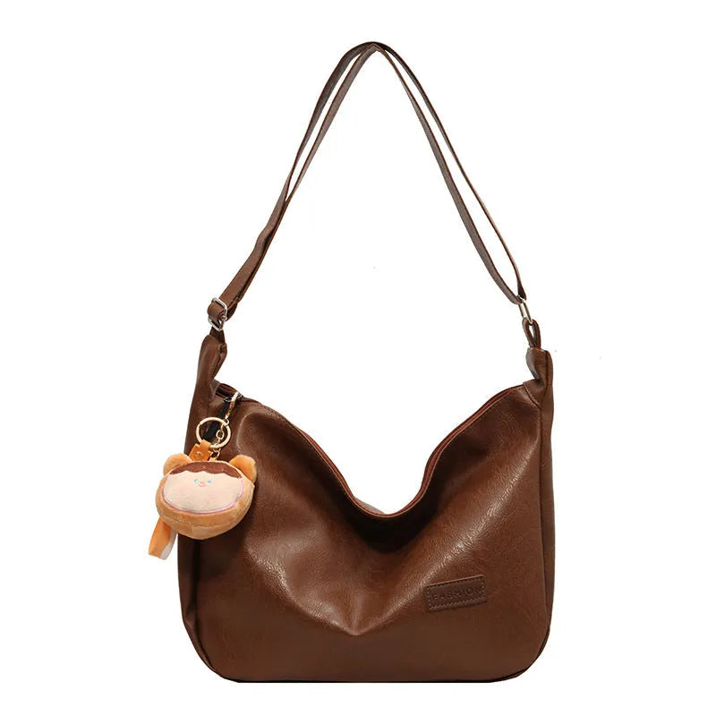 Retro PU shoulder messenger bag in dumpling shape with open pocket and sewing thread detail, black brown coffee options.