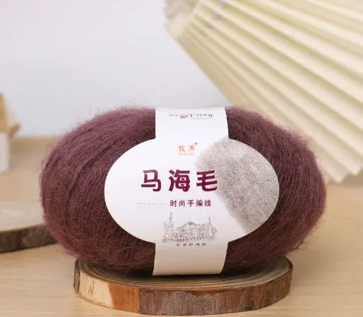 DIY mohair scarf knitting kit showing a ball of wool with 34 colour options including white, grey, pink, and blue.