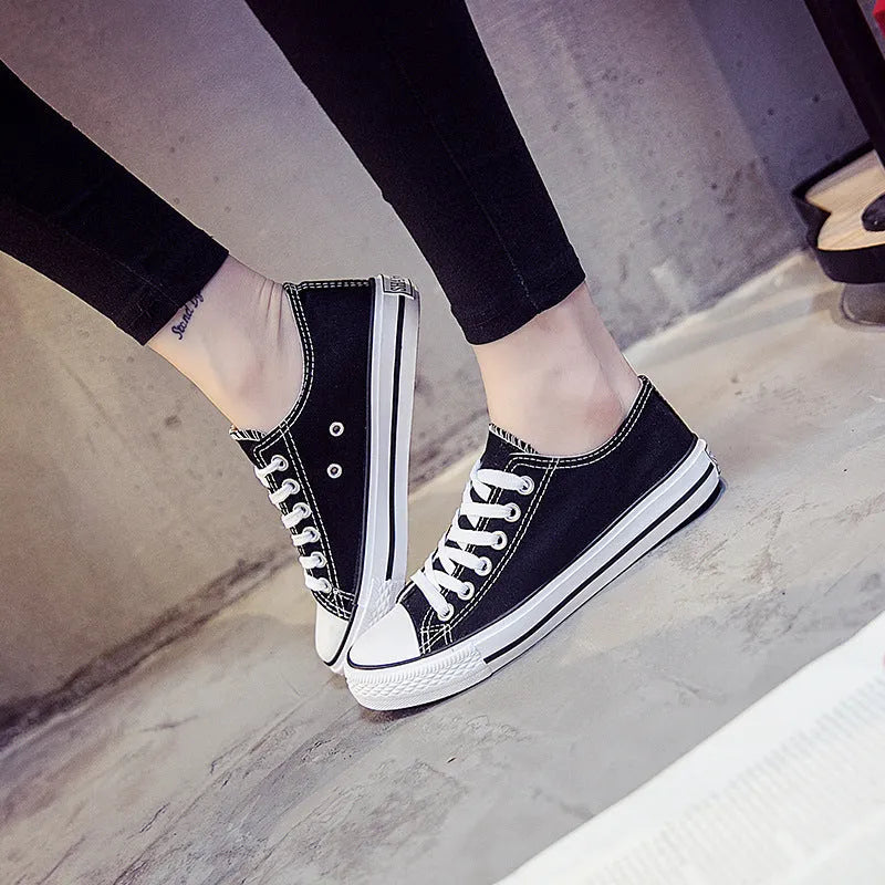 Women's canvas casual shoes in solid colours showing black, white black, white red, and all black options