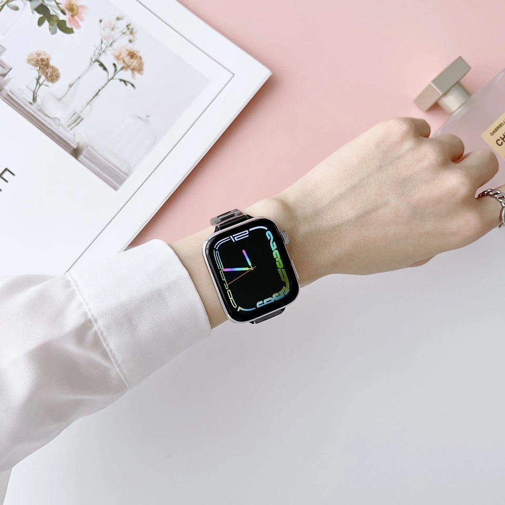 Stainless steel ceramic watch band for Apple Watch 38-49mm in gold with black ceramic finish on a wrist