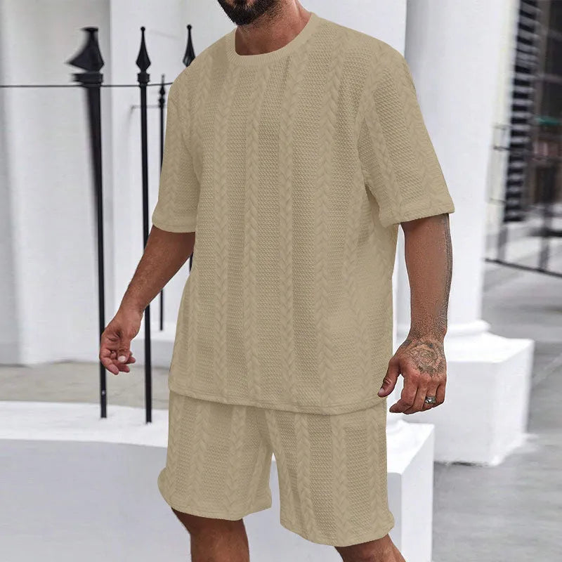 Knitted jacquard short sleeve pullover and matching shorts set in a solid colour on a hanger.