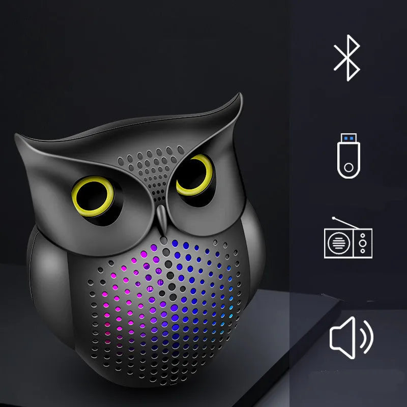Black owl-designed wireless Bluetooth speaker with USB cable