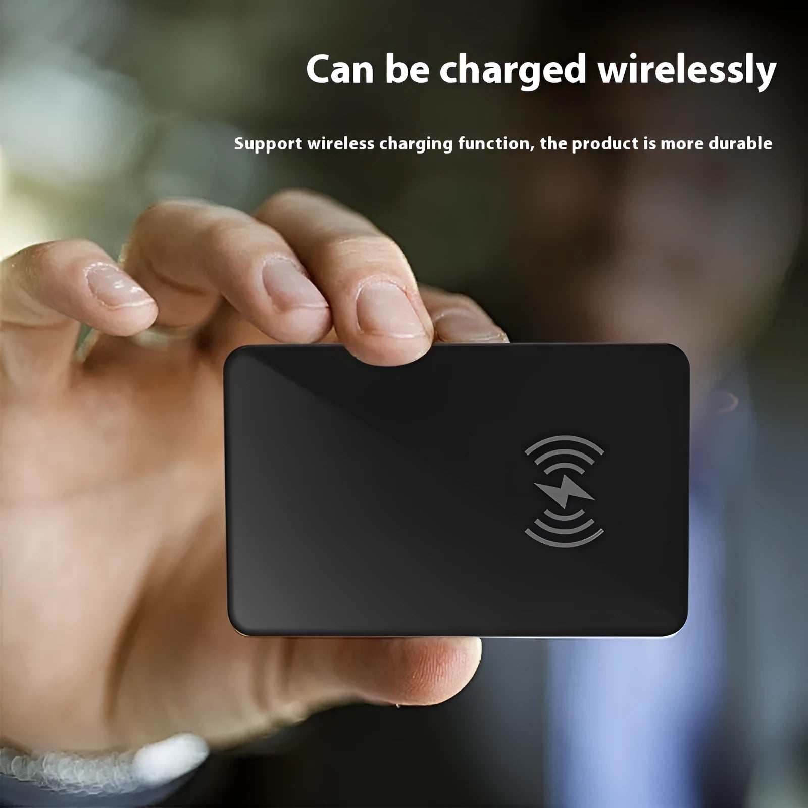 Black card-shaped pet tracker with wireless charging and NFC, showing hanging hole.