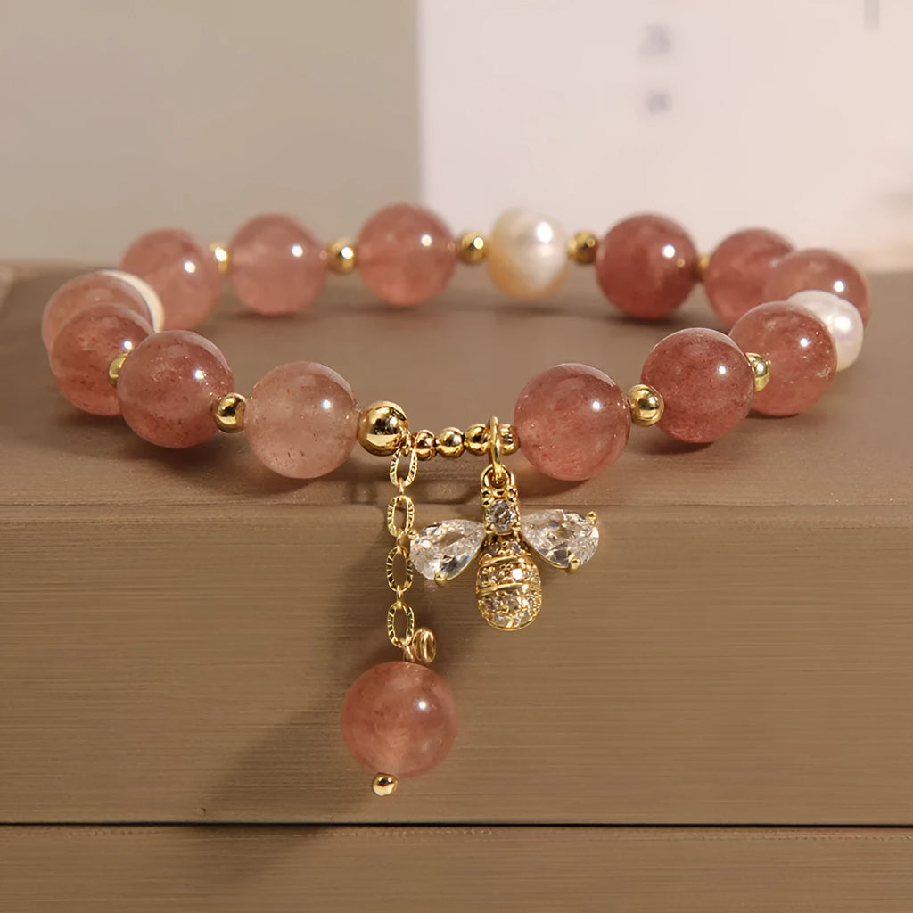 Women's bracelet with strawberry quartz beads, freshwater pearls, and zircon crystals on gold-tone clasp