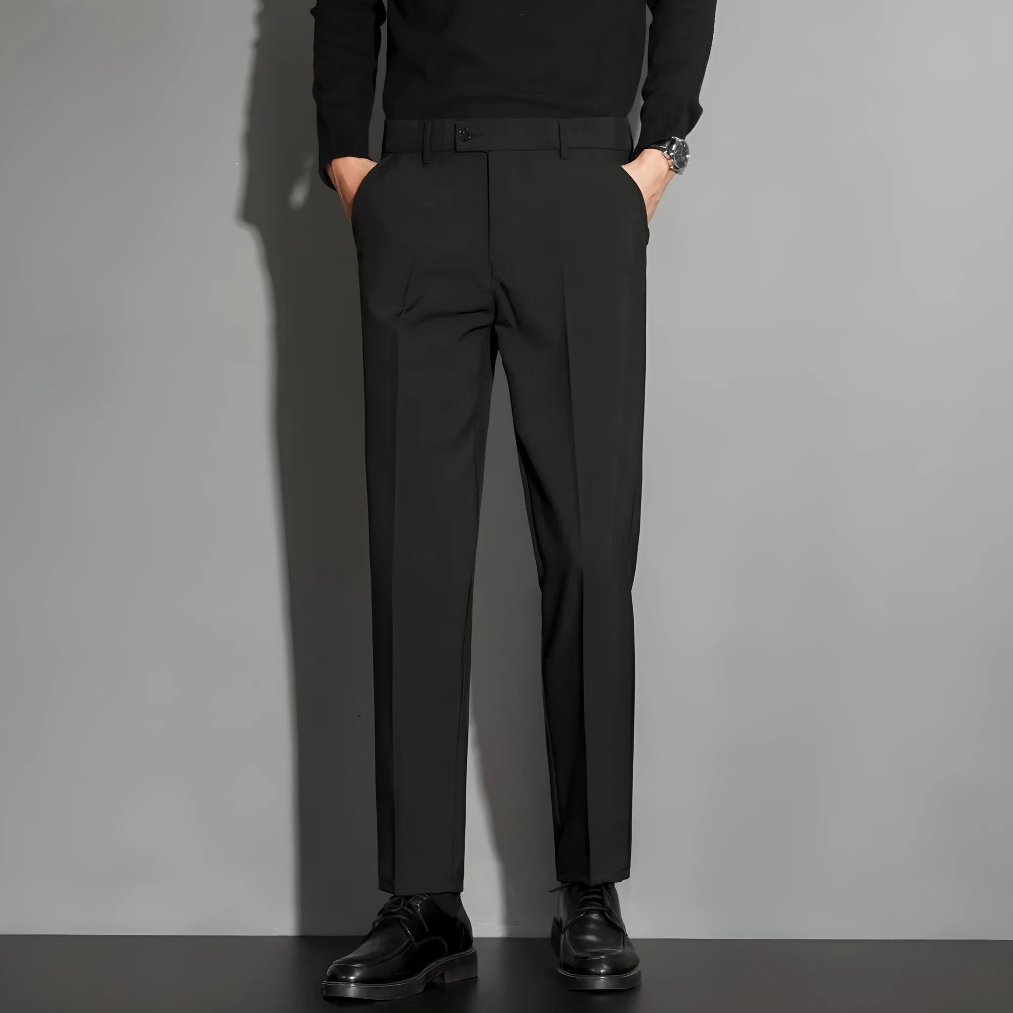 Men's straight cut ankle-length trousers in draping fabric showing apricot colour option