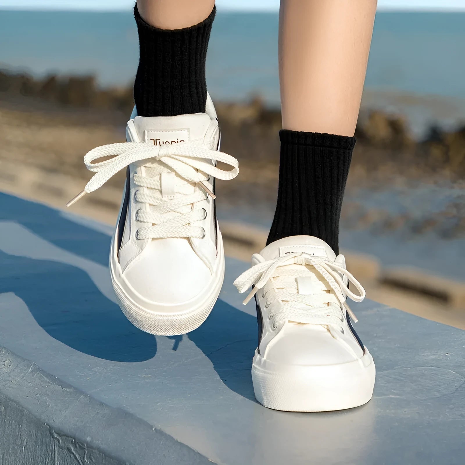 Women's blue and white vulcanised board shoes with a low-top lace-up design and round toe.