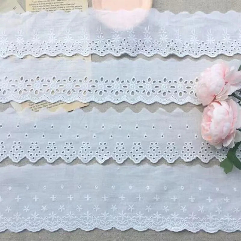Cotton embroidered lace cutout trim roll showing four different width options for DIY clothing projects
