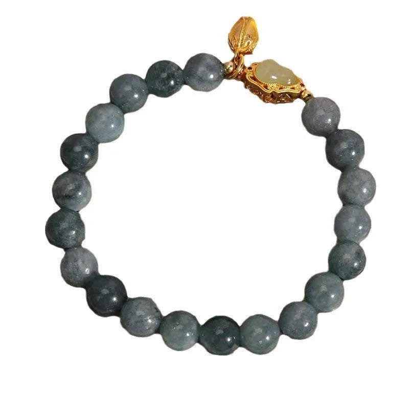 Sky blue natural stone gourd lotus flower pendant on a women's adjustable bracelet with electroplated metal.