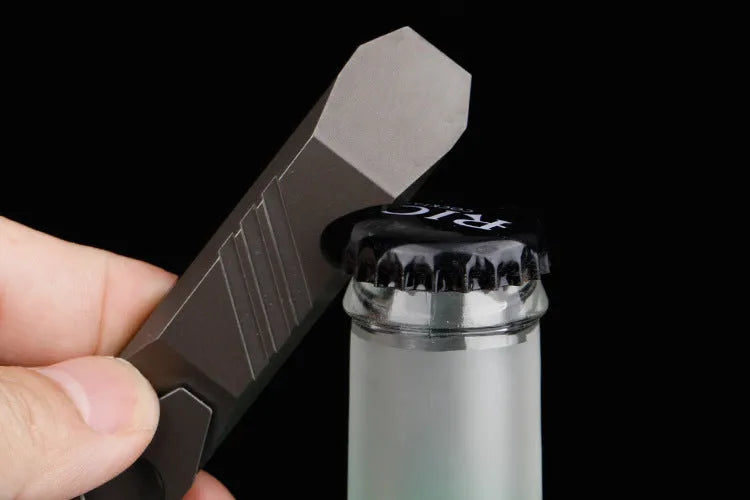 Titanium alloy multi-function crowbar tool with screwdriver tip and bottle opener in stone wash finish.