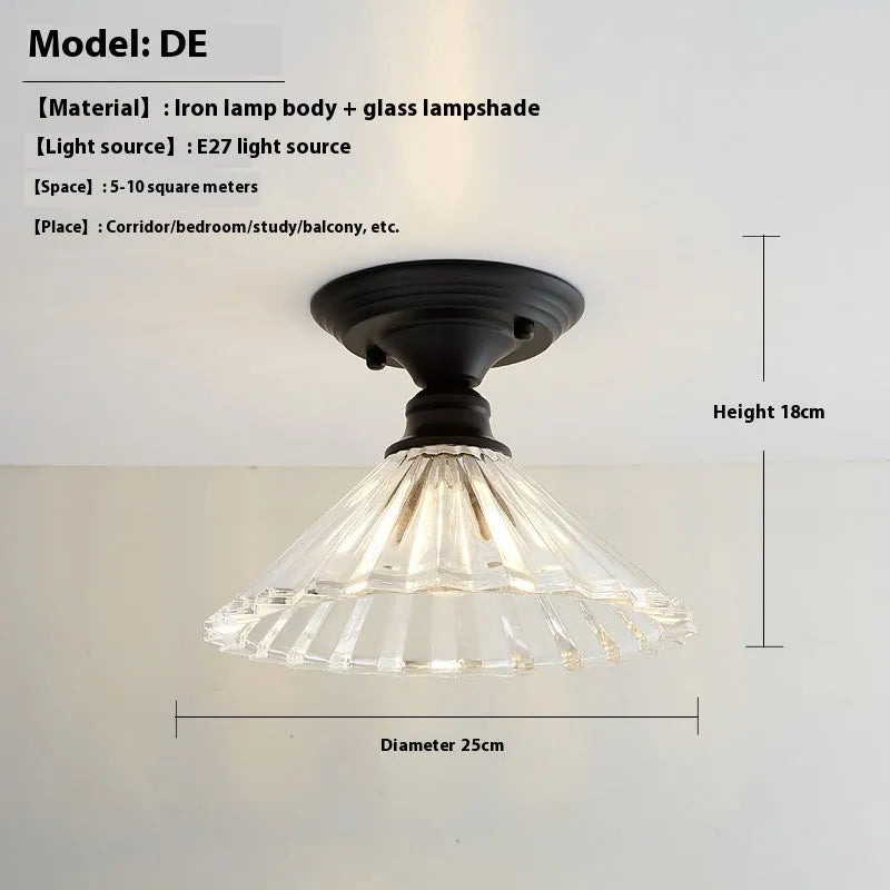 American retro style single-head ceiling or wall lamp with a glass cover.