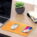 Brown leather and PU wireless charging mouse pad with Micro USB port for fast smartphone charging.