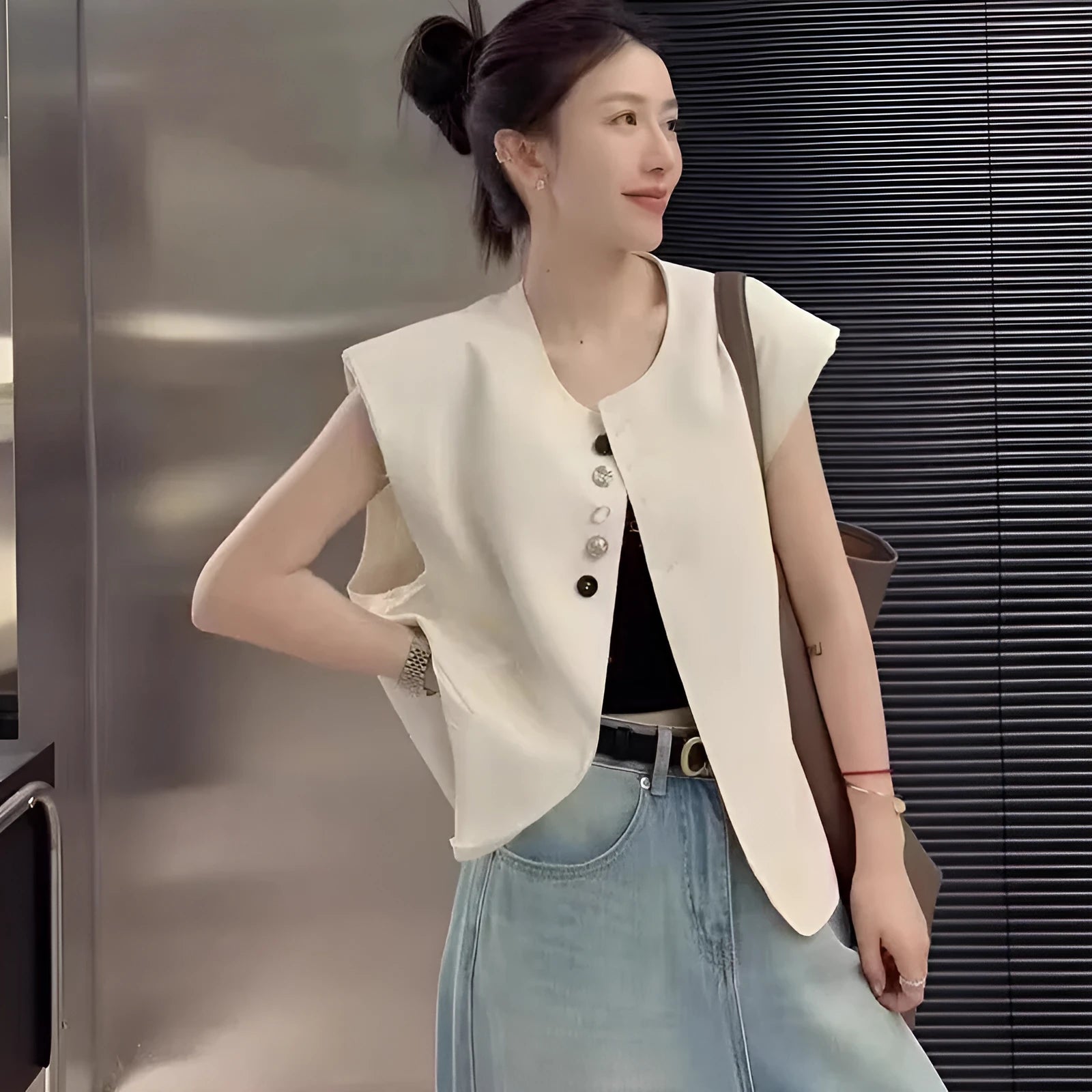 Women's loose-fit short-length polyester vest in milky white with side pockets
