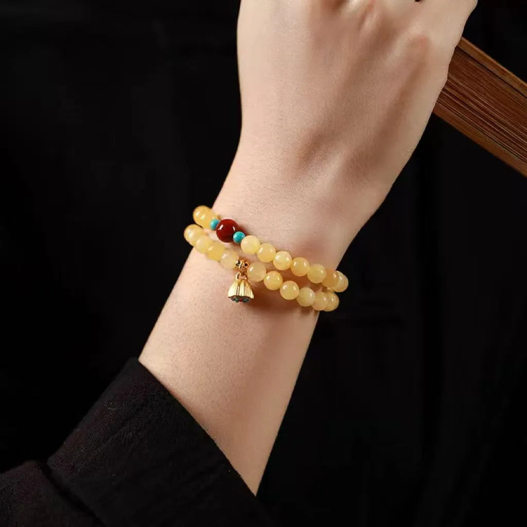 Handmade yellow jade bracelet with double ring design and lotus seedpod shapes