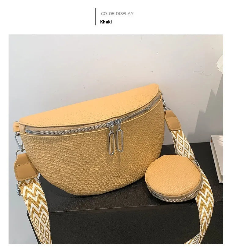 Solid colour women's crossbody bag with horizontal square clamshell design and zip closure